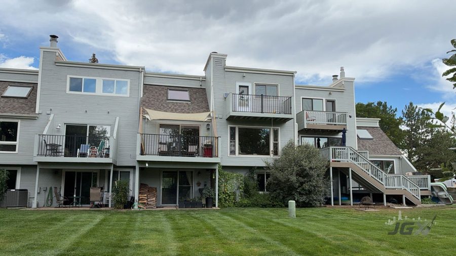 Multi-family townhome building exterior with balconies and decks