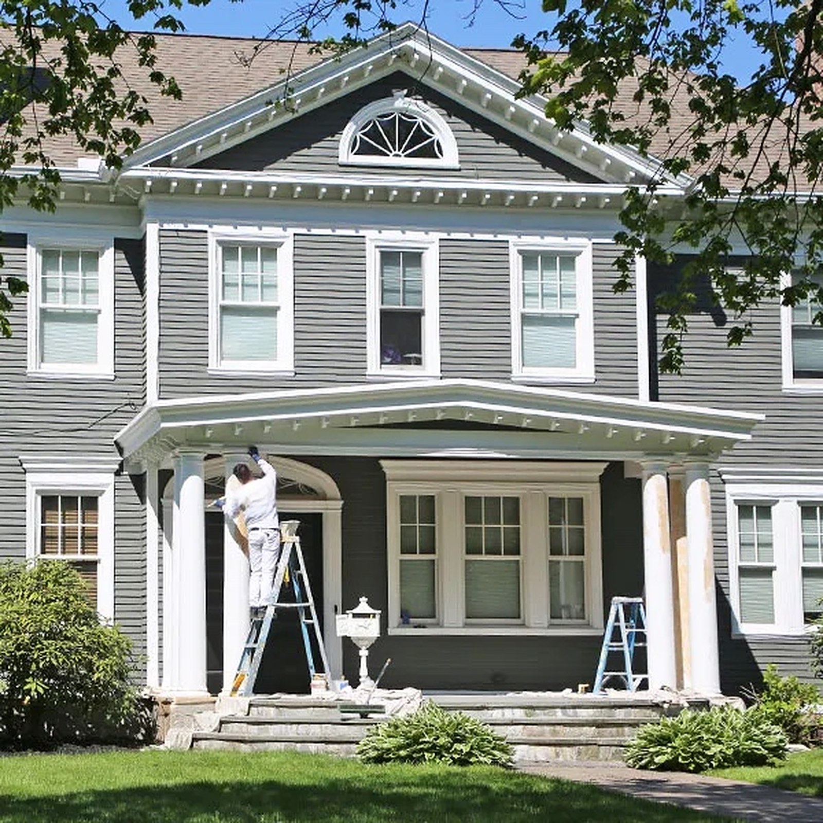 JGX Painting crew painting a historic home exterior